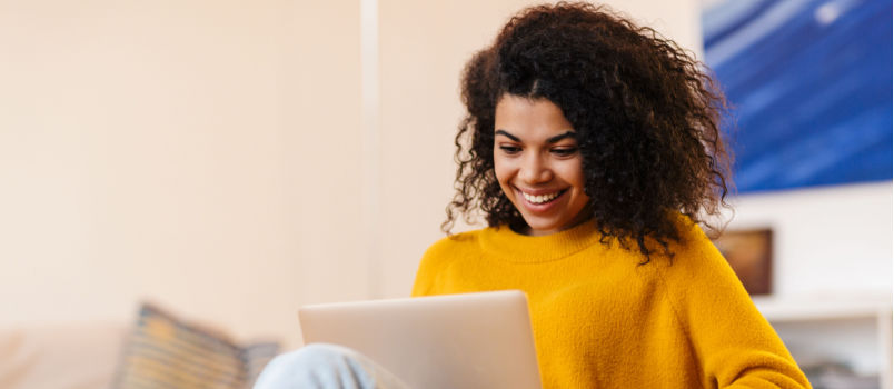 Cheerful women using laptop