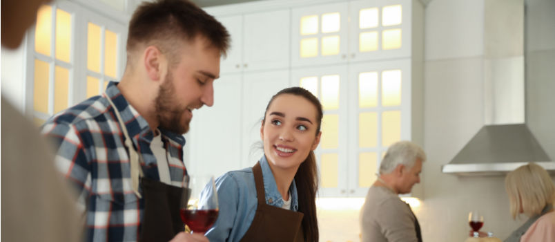 Couple cooking together in kitchen