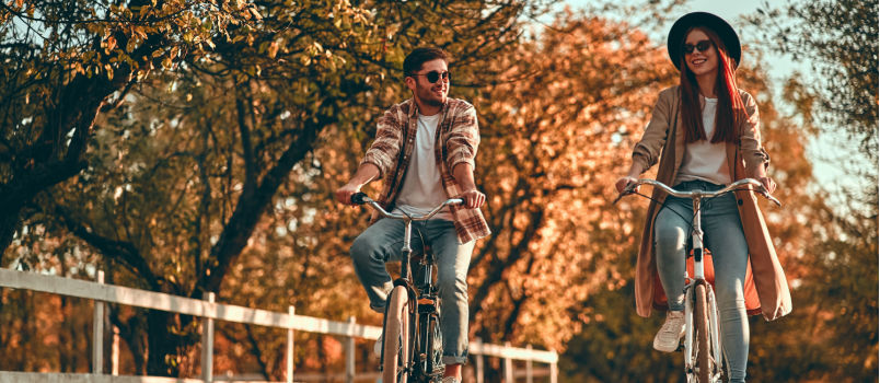 Young couple bicycle in the park