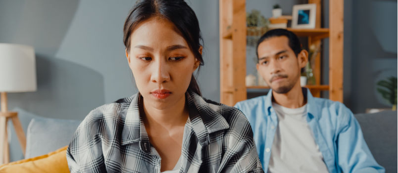 Asian couple not talking to each other