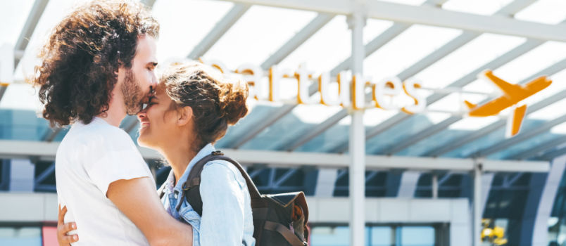 Couple meeting at airport