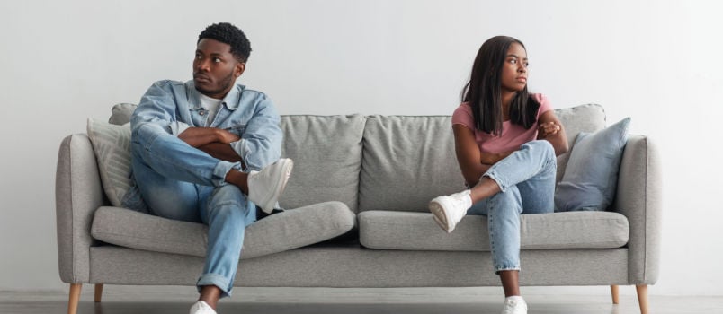 Couple sitting apart after conflict