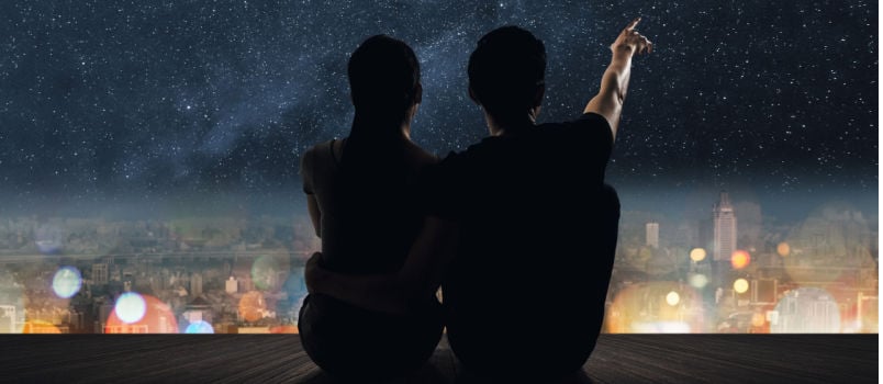 Couple sitting on ground