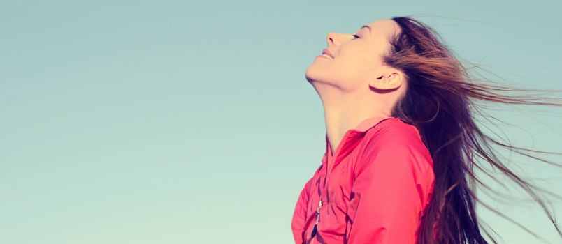 Women smiling looking in the sky
