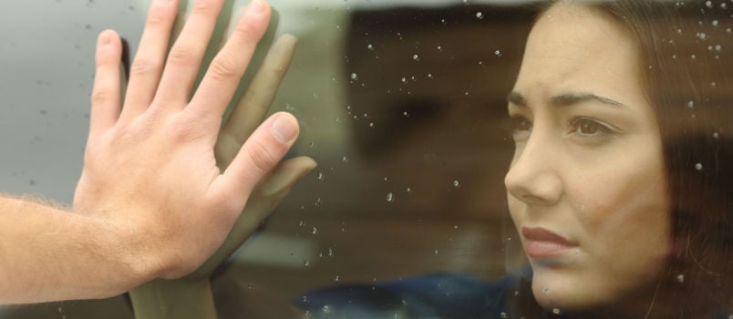 Women sitting in car saying goodbye