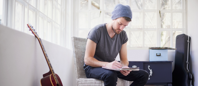 handsome man writing song