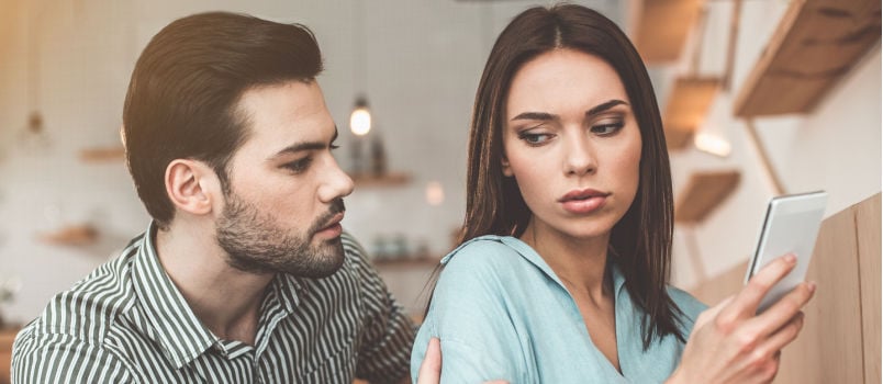 Worried young man consoling his wife