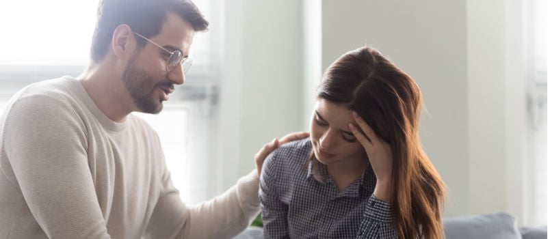 Man confronting sad women