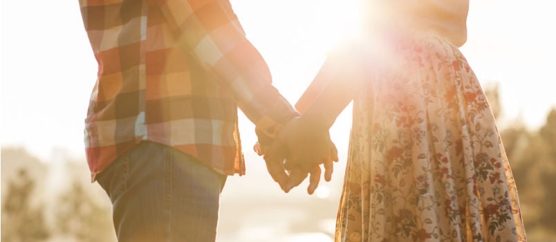 Young couple walking outside