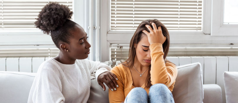 Girl confronting another sad girl