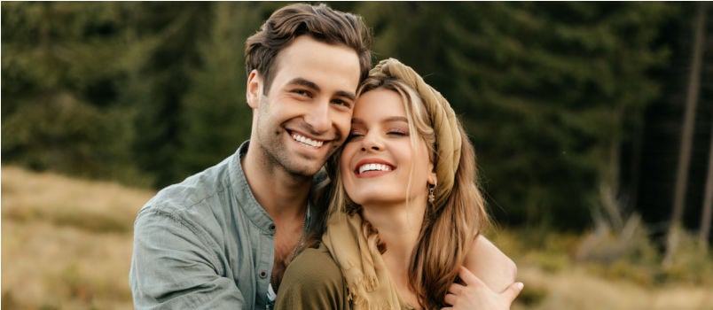 Young couple hugging and smiling