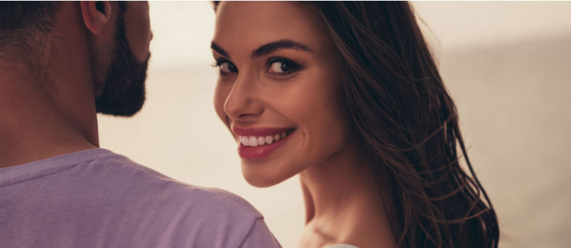 Cheerful girl looking back in camera