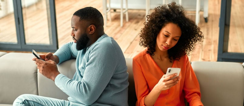 Couple sitting on sofa