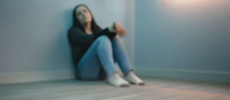 Depressed women sitting alone