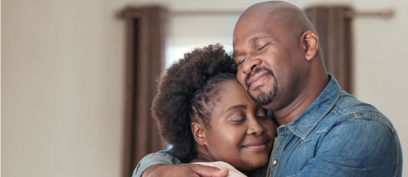 Couple smiling hugging each other