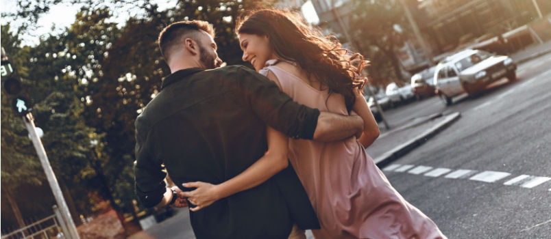Young couple walking on street