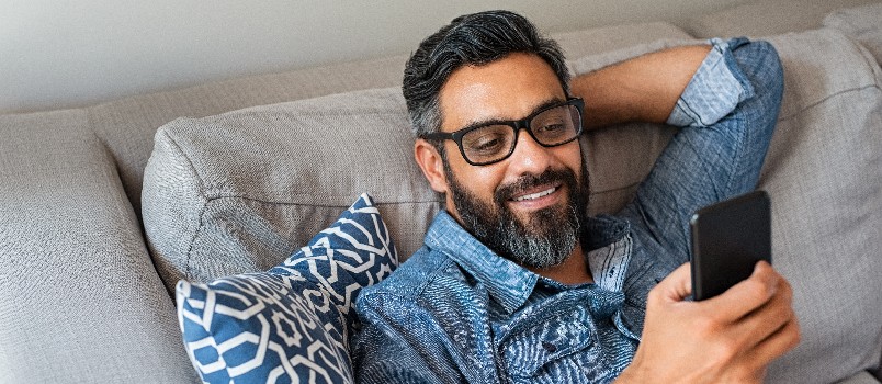 Happy man using smartphone