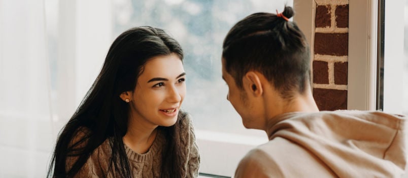 Couple talking in cafe