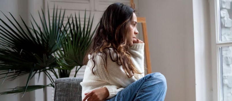 Sad woman sitting alone