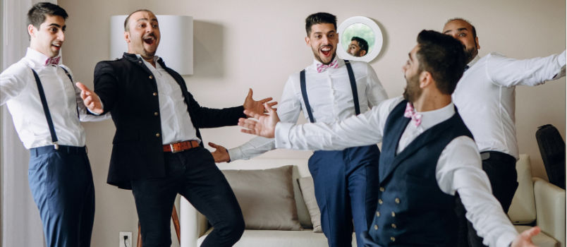 Groom and grroms man dancing in hotel room