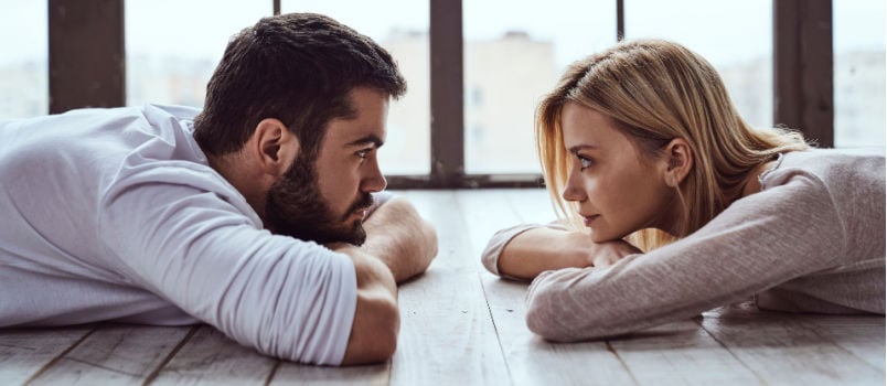 Young happy couple looking at each other