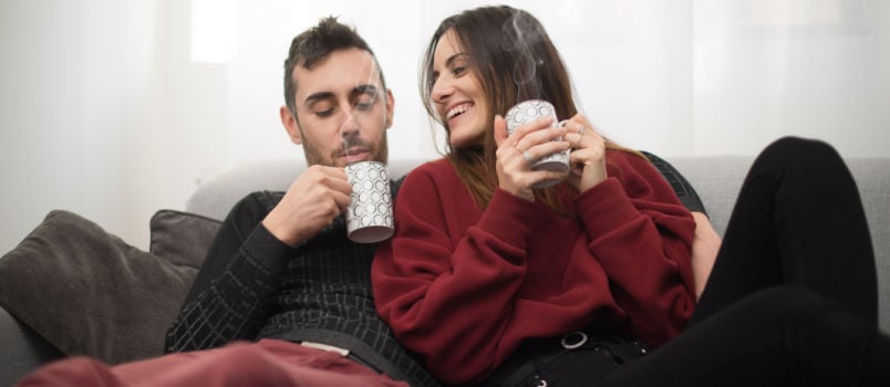 Couple having coffee together at home