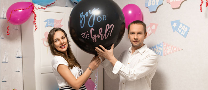 Couple holding balloon