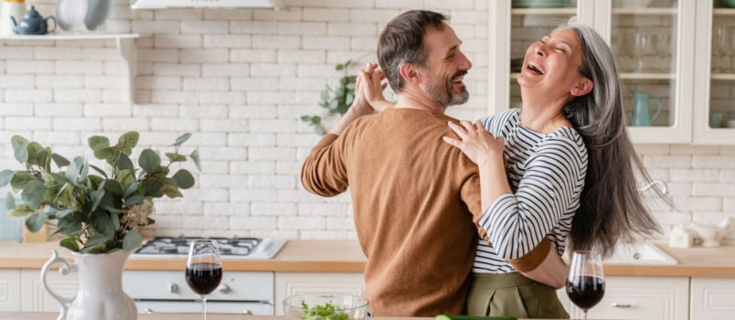 Couple dancing in kitchen