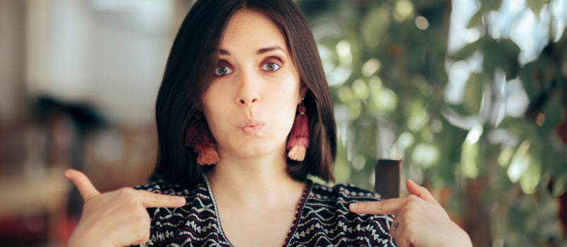 Smug selfie woman pointing herself