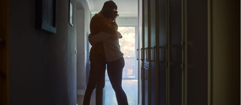 Sad couple comforting each other