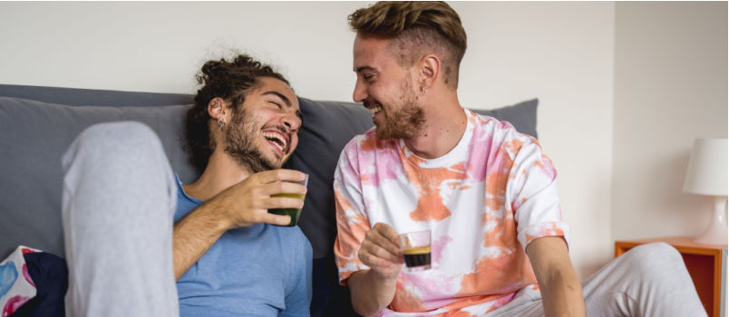 Young gay couple having fun at home