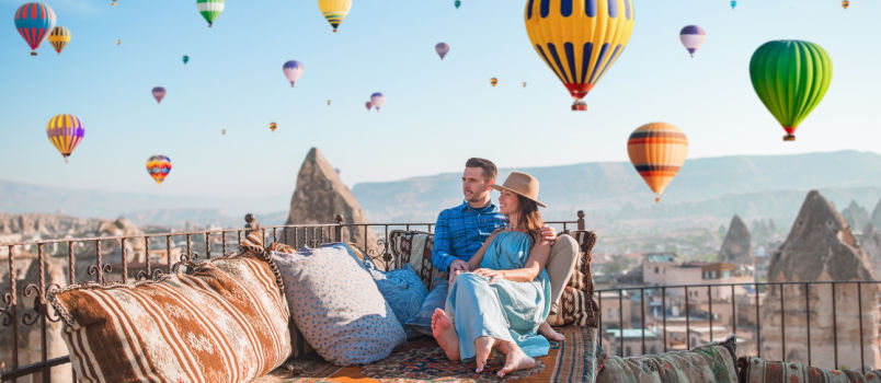 young couple sunrise on rooftop
