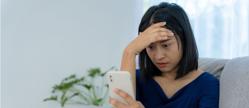 Asian woman disappointed