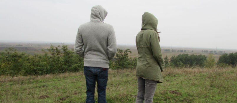 Man and woman standing apart from each other