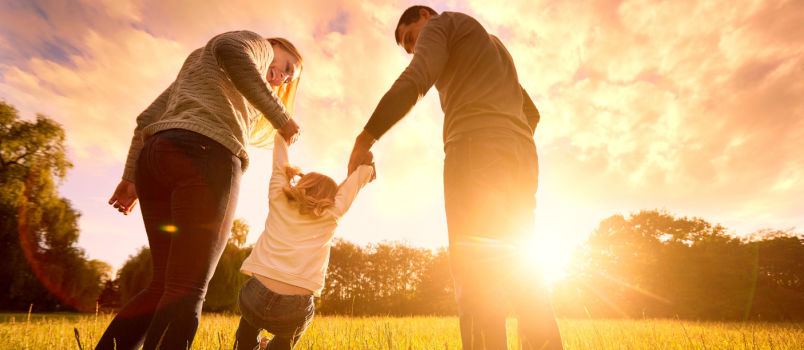 Happy family spending night in park