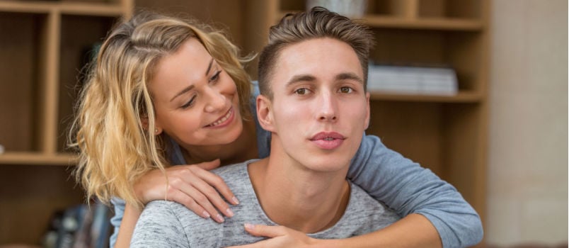 Woman hugging man from back