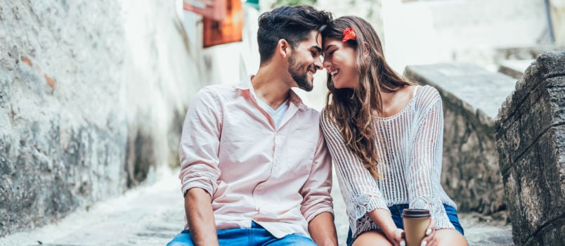 Happy couple sitting on stairs