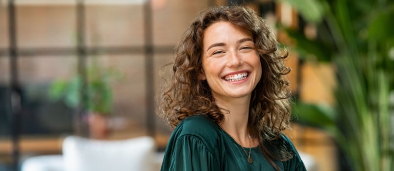 Happy woman looking in camera 