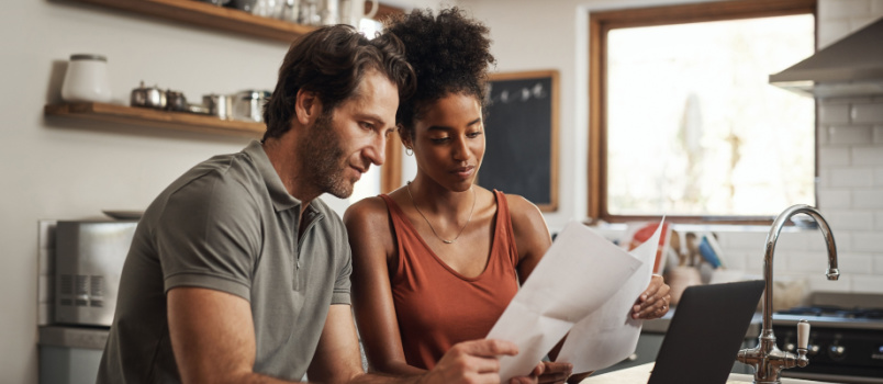 Couple looking at finance paper