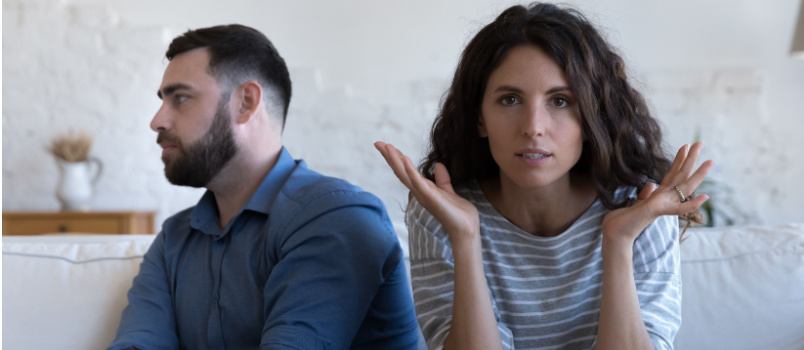 Married couple sitting on couch