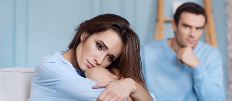 Young sad woman sitting