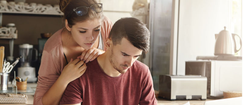 Young family working on bills