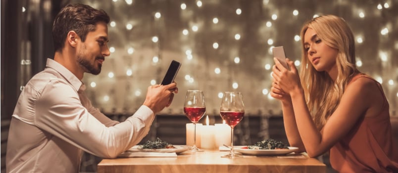 Couple using smartphone on date