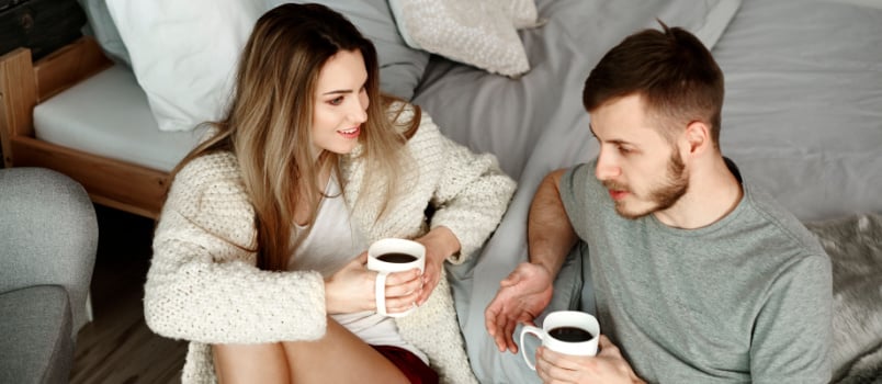 Happy couple having coffee together