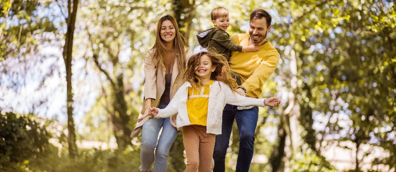 Happy family playing in garden