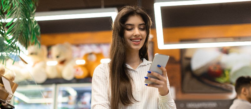 Happy woman using smartphone 