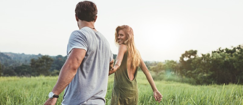 Young couple walking in farm