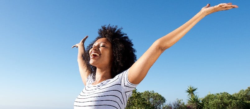 Happy young woman standing outdoor