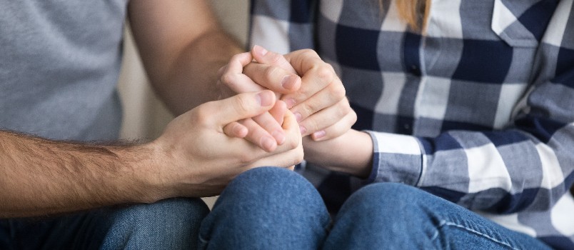 Couple holding each other hands comforting each other