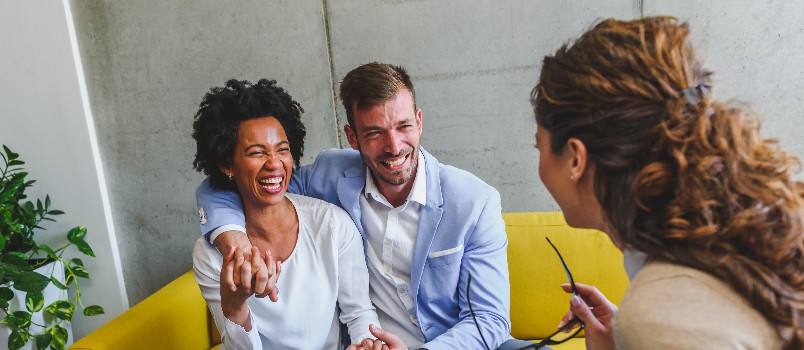 Young diverse couple talking to therapist